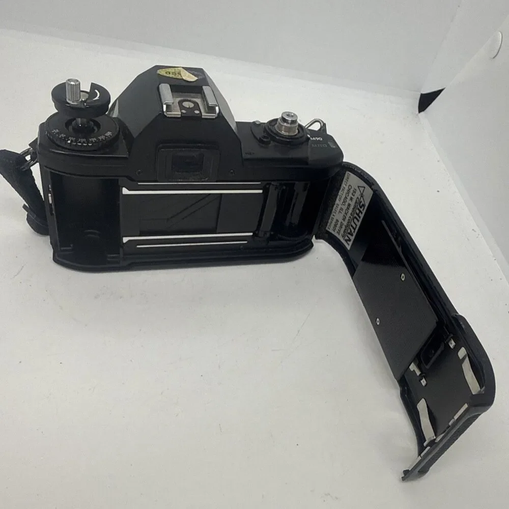 Vintage Nikon EM Black SLR Film Camera with Nikon Lens